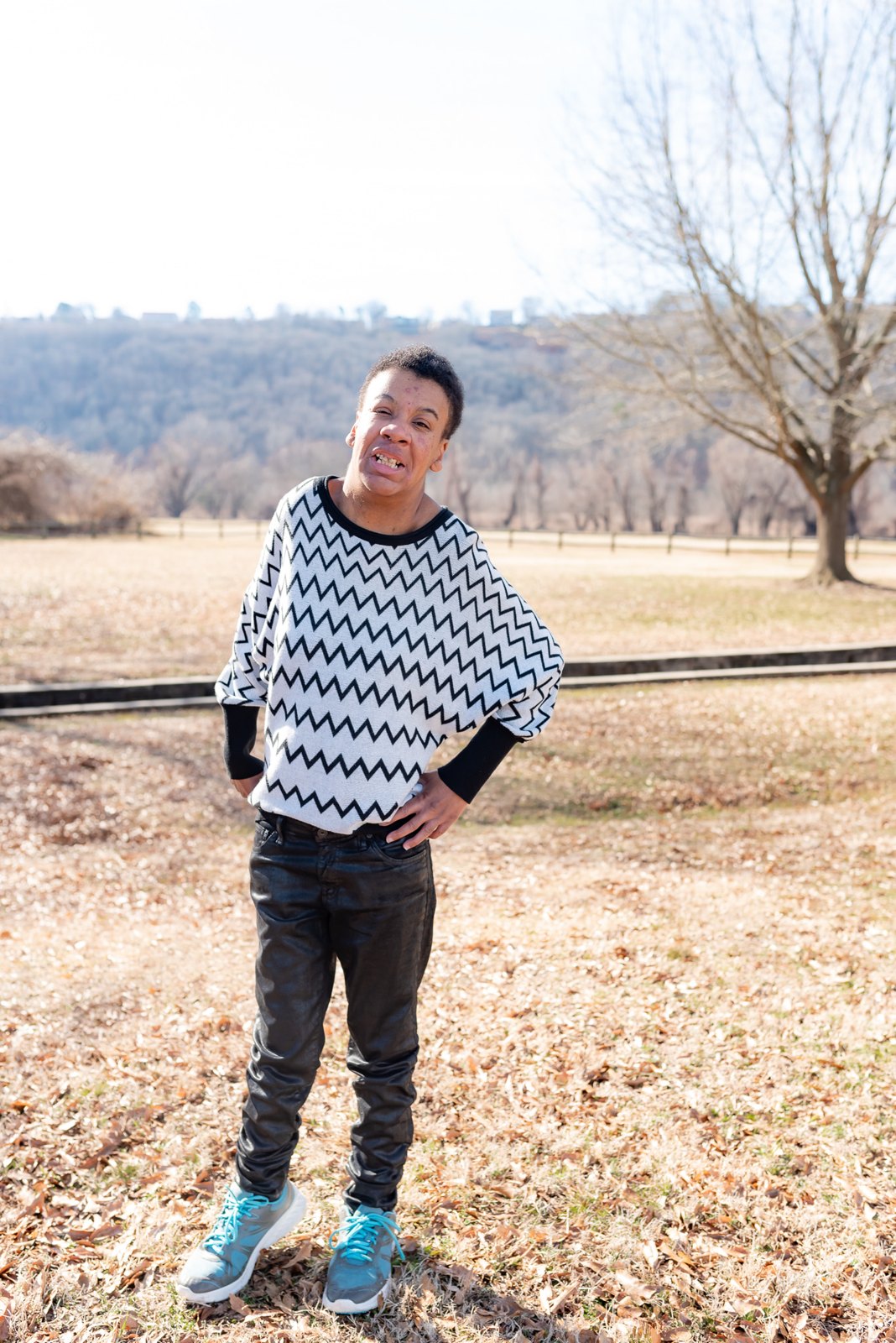 Miss T standing on her own in a field, hands on her hips