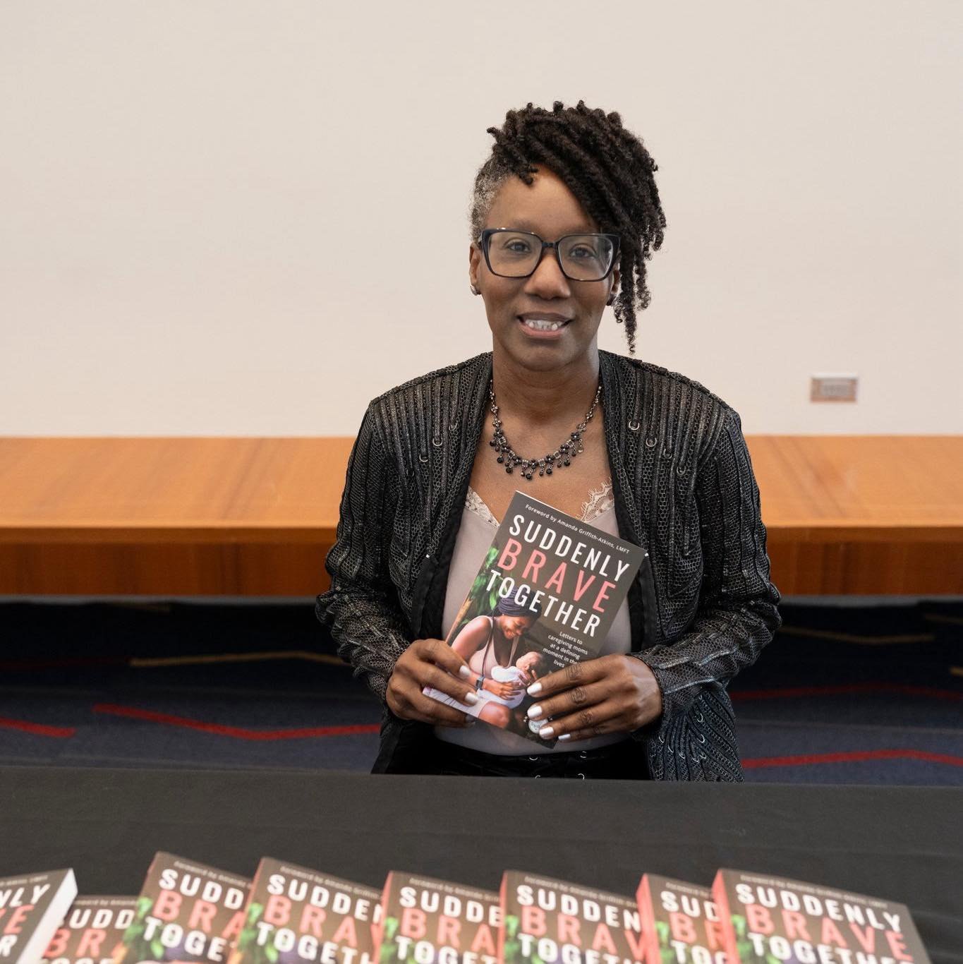 Tina Jackson with her book, Suddenly Brave Together