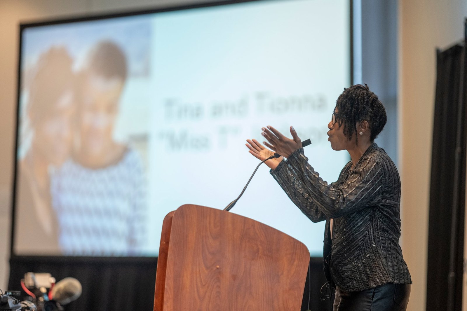 Tina Jackson speaking at a podium